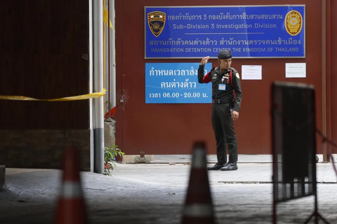 A security guard stands outside the immigration detention centre in Bangkok, Thailand on Feb 27.