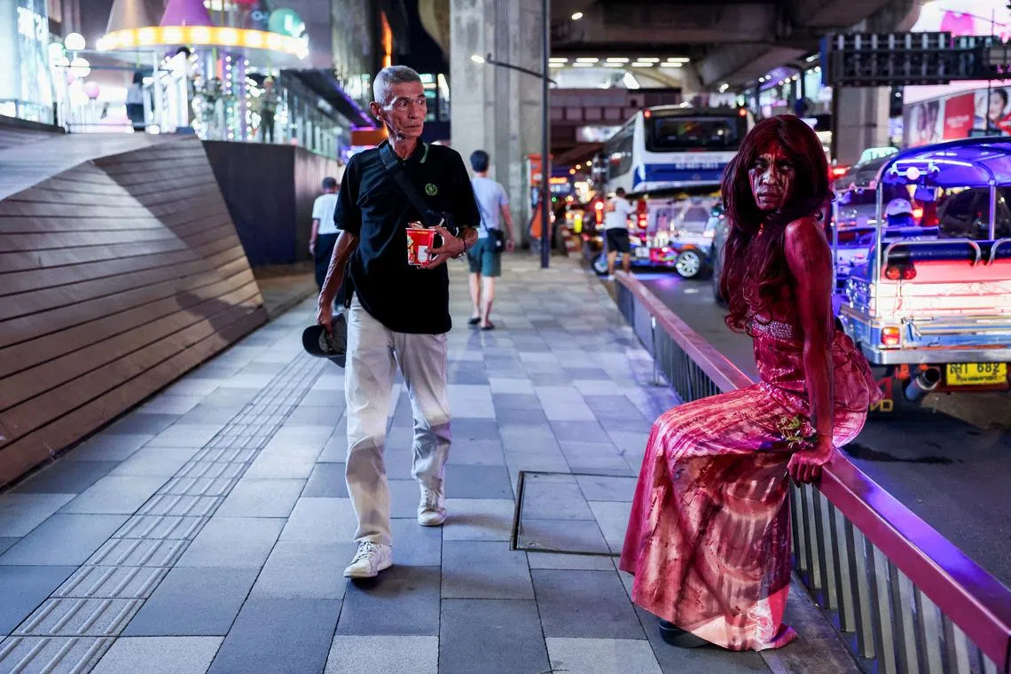 A woman posing for a picture as she celebrates Halloween in Bangkok, Thailand, on Oct 31, 2024. 