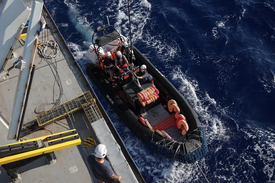 FILE PHOTO: Crew launches a rigid-hulled inflatable boat (RHIB), from the migrant search and rescue ship Sea-Watch 5, operated by German NGO Sea-Watch, in the search and rescue (SAR) zone in the central Mediterranean, off Libya, August 10, 2025. REUTERS/Louisa Gouliamaki/File Photo