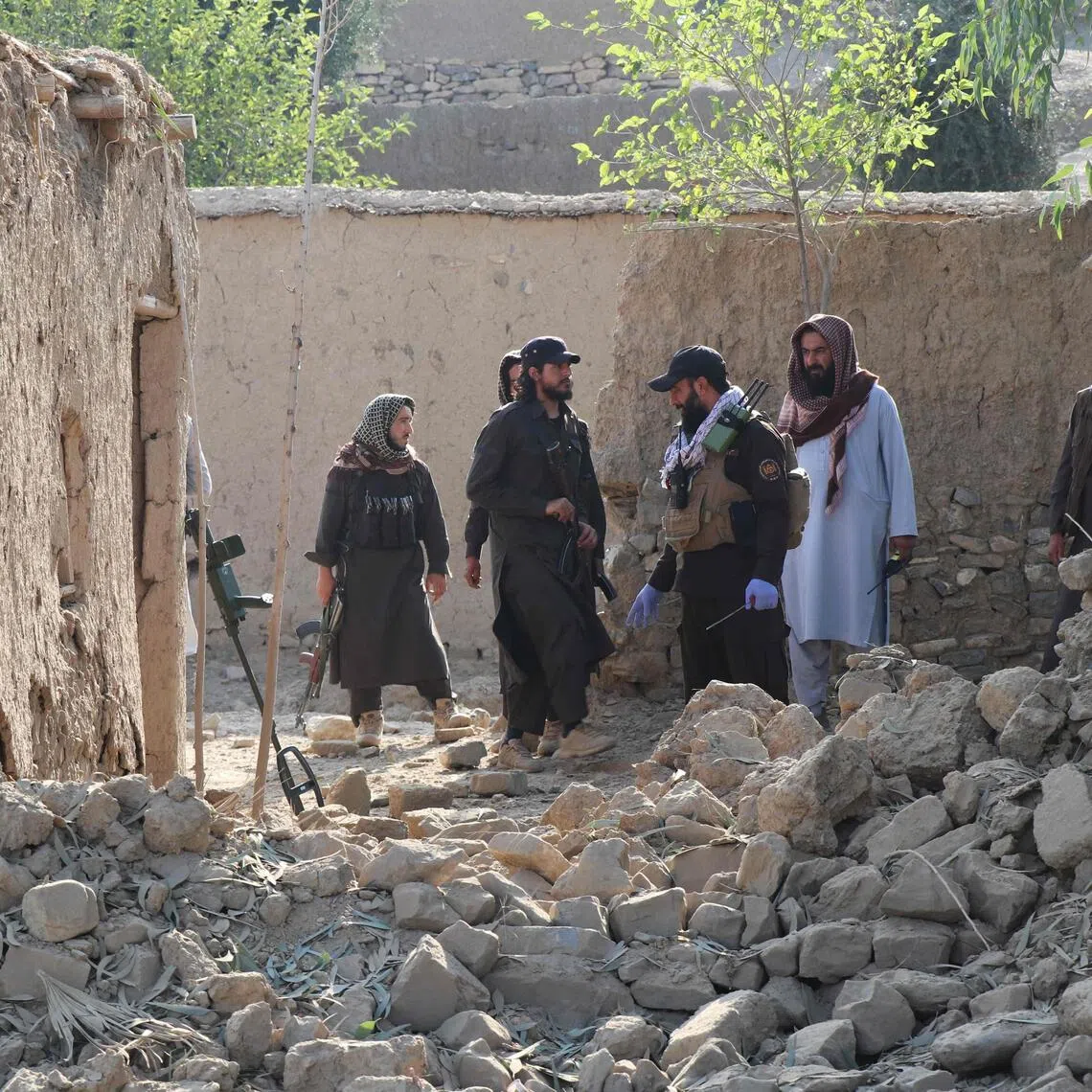 Taliban security personnel inspect the site, after Pakistani air strike struck Gurbuz district in Afghanistan’s Khost province on Sept 24.