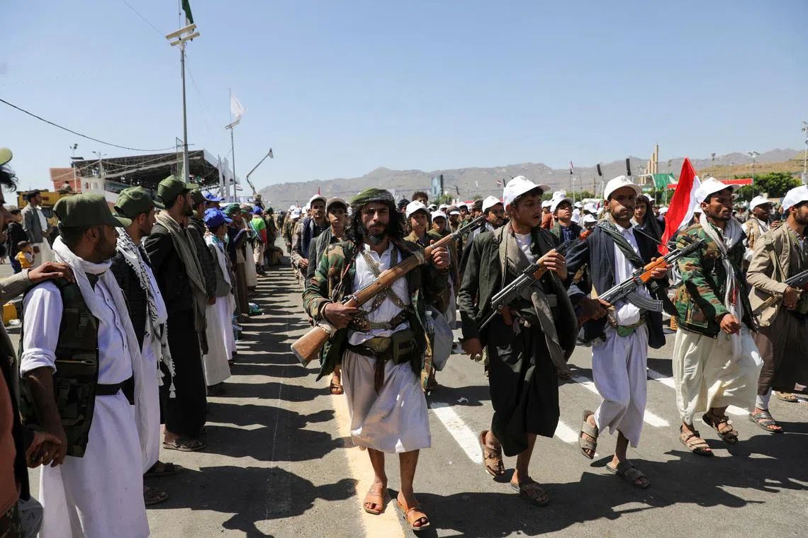 FILE PHOTO: Houthi-mobilized fighters parade during a ceremony marking the 10th anniversary of the Houthi takeover in Sanaa, Yemen September 21, 2024. REUTERS/Khaled Abdullah/File Photo