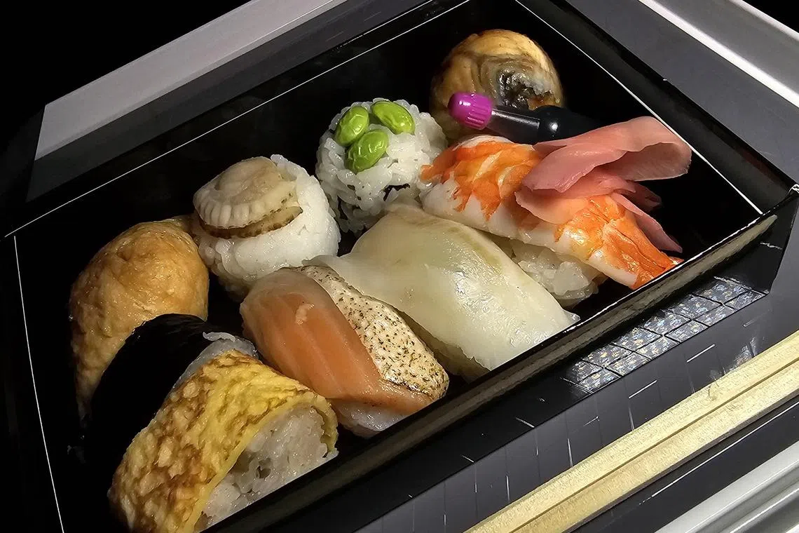 Meals on budget carrier Air Japan include sushi bento boxes on direct flights from Singapore to Tokyo’s Narita International Airport.