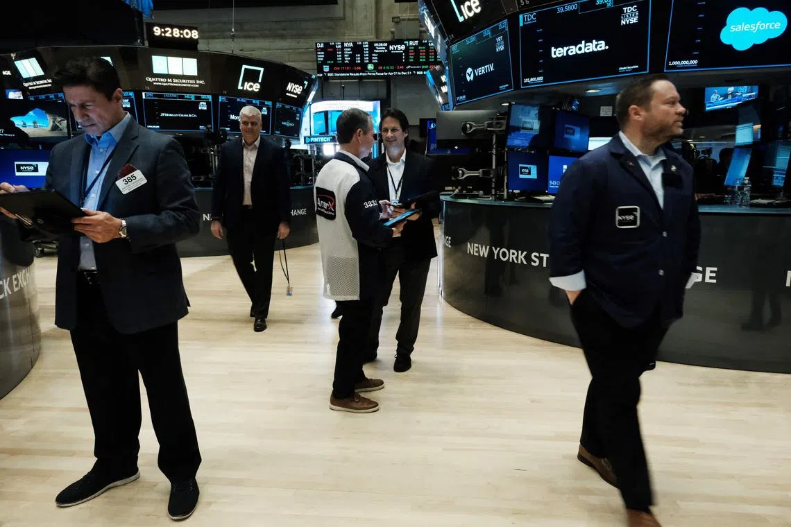 Traders work on the floor of the New York Stock Exchange.