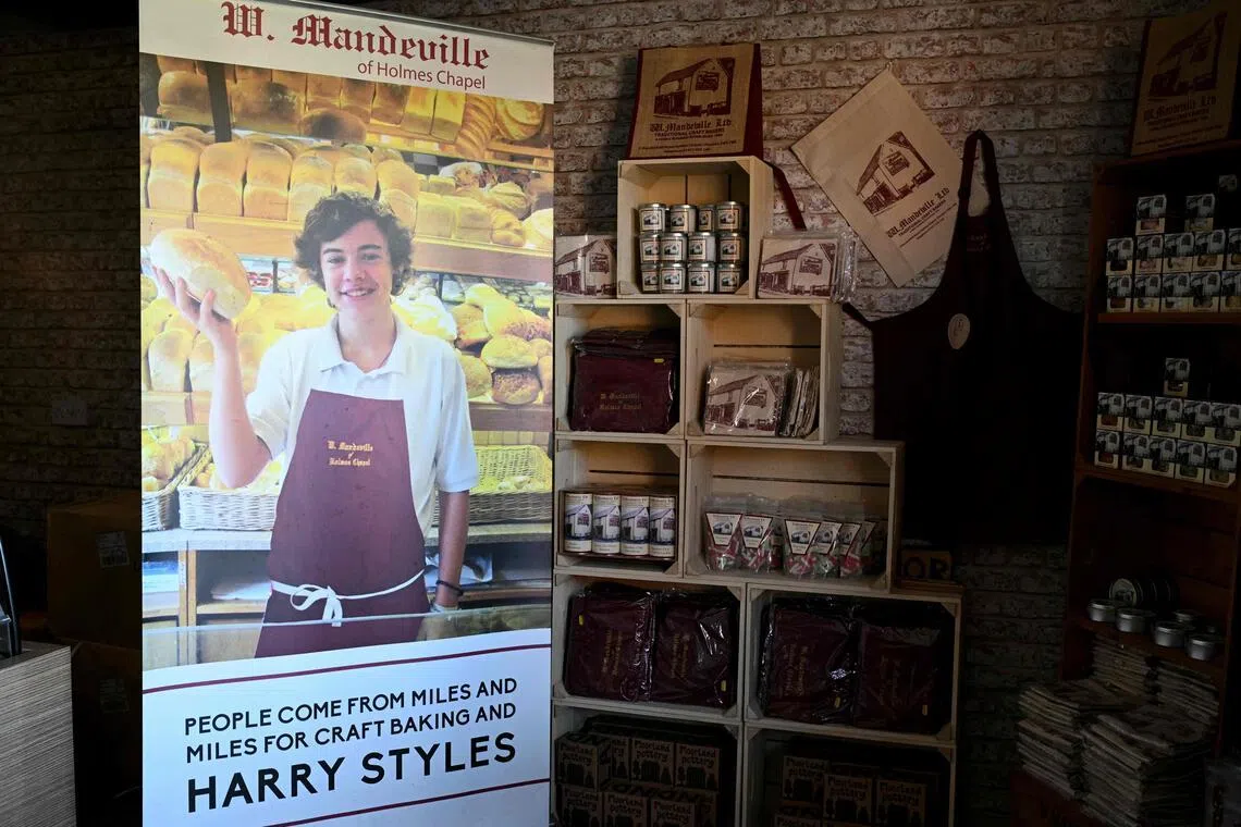 A poster of One Direction singer Harry Styles, from when he worked at the W Mandeville bakery in Holmes Chapel, north-west England, on March 4.