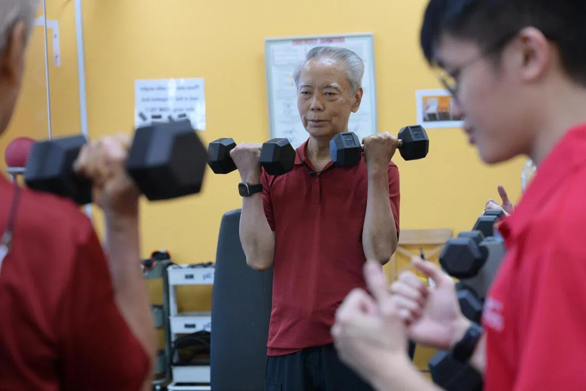 wqheart22/ST20260324_202622100975/Ng Sor Luan/Patient with atrial fibrillation Mr Tan Check Wanparticipating in a heart wellness programme by Singapore Heart Foundation at Singapore Heart Foundation Heart Wellness Centre @ Bishan. He is assisted by therapy assistant, Cheval Lim, 28. 
