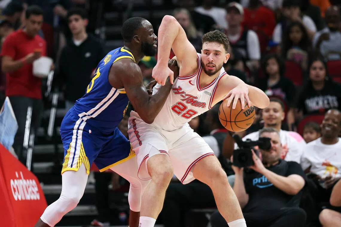 Golden State Warriors forward Draymond Green defending against centre Alperen Sengun during the shock 115-113 overtime victory over the Houston Rockets at Toyota Center on March 5, 2026.