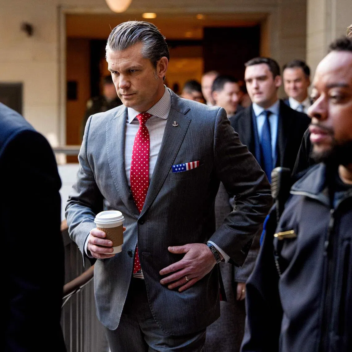 US Secretary of Defence Pete Hegseth walking from the Senate to the House on Dec 16, as he attends closed door meetings with lawmakers on Capitol Hill.