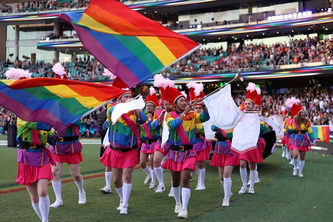 FILE PHOTO: Participants celebrate the Sydney Gay and Lesbian Mardi Gras Parade under coronavirus disease (COVID-19) safety guidelines at the Sydney Cricket Ground in Sydney, Australia, March 6, 2021.  REUTERS/Loren Elliott/File Photo