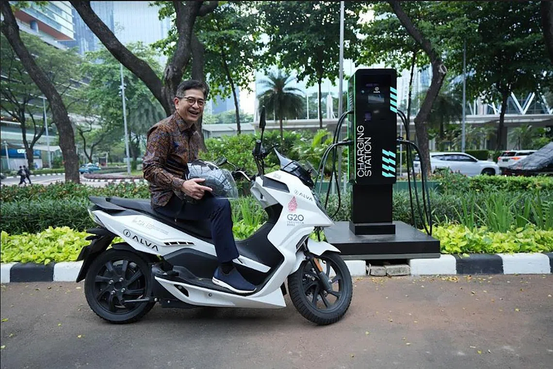 Indonesian Chamber of Commerce and Industry (Kadin) chairman Arsjad Rasjid, seen here on an electric motorcycle, detailed some challenges facing the nation as it moves to electrify its transportation infrastructure, switch from coal to renewable energy, and reach net-zero emissions by 2060.