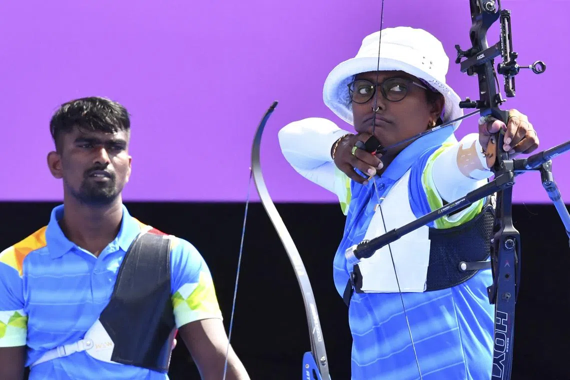 FILE PHOTO: Tokyo 2020 Olympics - Archery - Mixed Team - Quarterfinals - Yumenoshima Archery Field, Tokyo, Japan - July 24, 2021. Deepika Kumari of India and Pravin Ramesh Jadhav of India during competition REUTERS/Clodagh Kilcoyne/File Photo