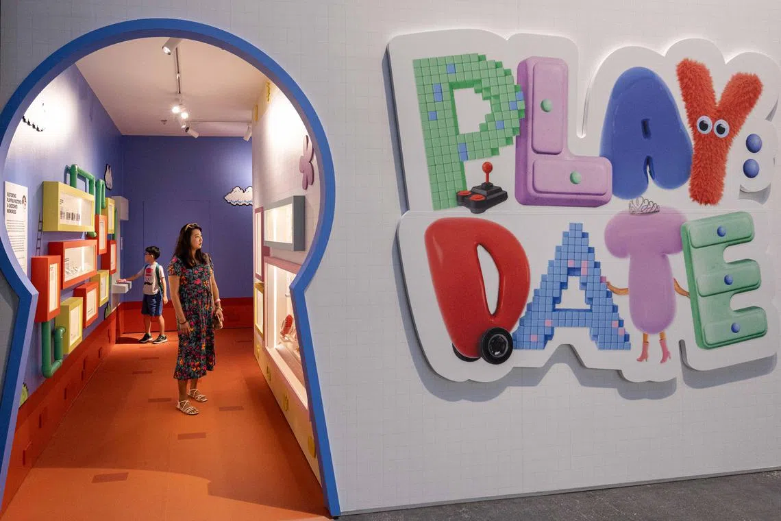 ST20240702_202466709957/clplay03/Brian Teo/Charmaine Lim/EMBARGO UNTIL JULY 3, 12PM. Members of the media touring the 'Play:Date – Unlocking Cabinets of Play' showcase during the media preview at National Museum on July 2, 2024. ST PHOTO: BRIAN TEO