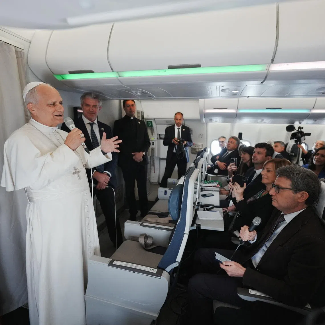 Pope Leo XIV speaks to journalists aboard the papal flight from Malabo to Rome, April 23, 2026, at the end of his 11-day pastoral visit to Africa.     Andrew Medichini/Pool via REUTERS