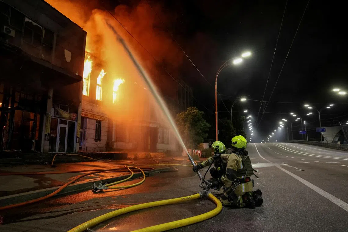 Firefighters work at the site of a Russian drone attack, amid Russia's attack on Ukraine, in Kyiv, Ukraine June 6, 2025. REUTERS/Stringer