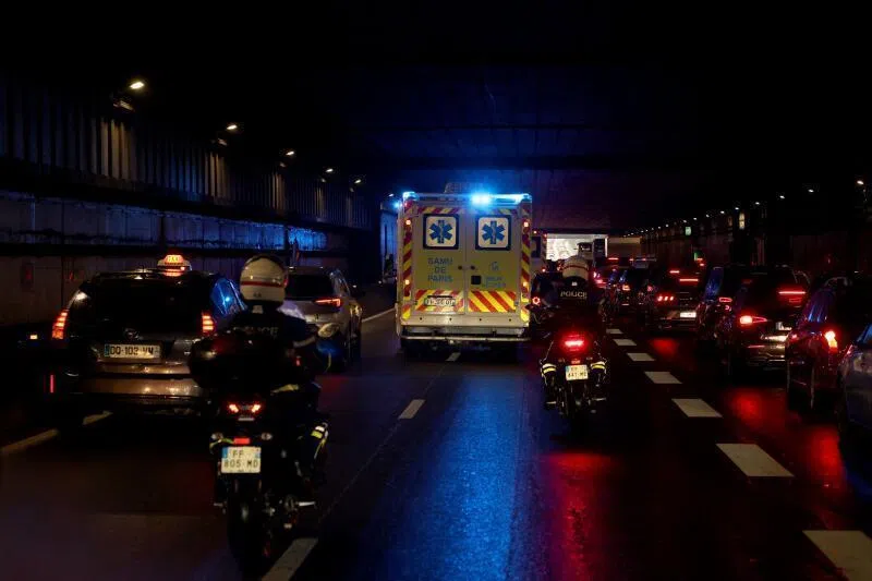 Ambulances transporting French passengers of the MV Hondius driving in a tunnel heading to Paris on May 10, after a plane repatriating them landed Le Bourget airport, France.