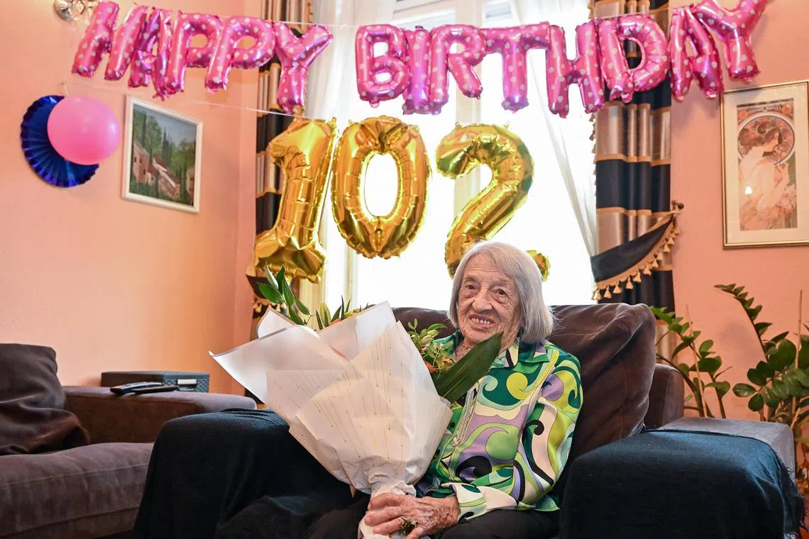 Hungarian-Israeli retired Olympic and world champion artistic gymnast and coach Agnes Keleti posing for a picture as she prepares for her 102nd birthday in her flat in Budapest, Hungary, in Jan 2023.