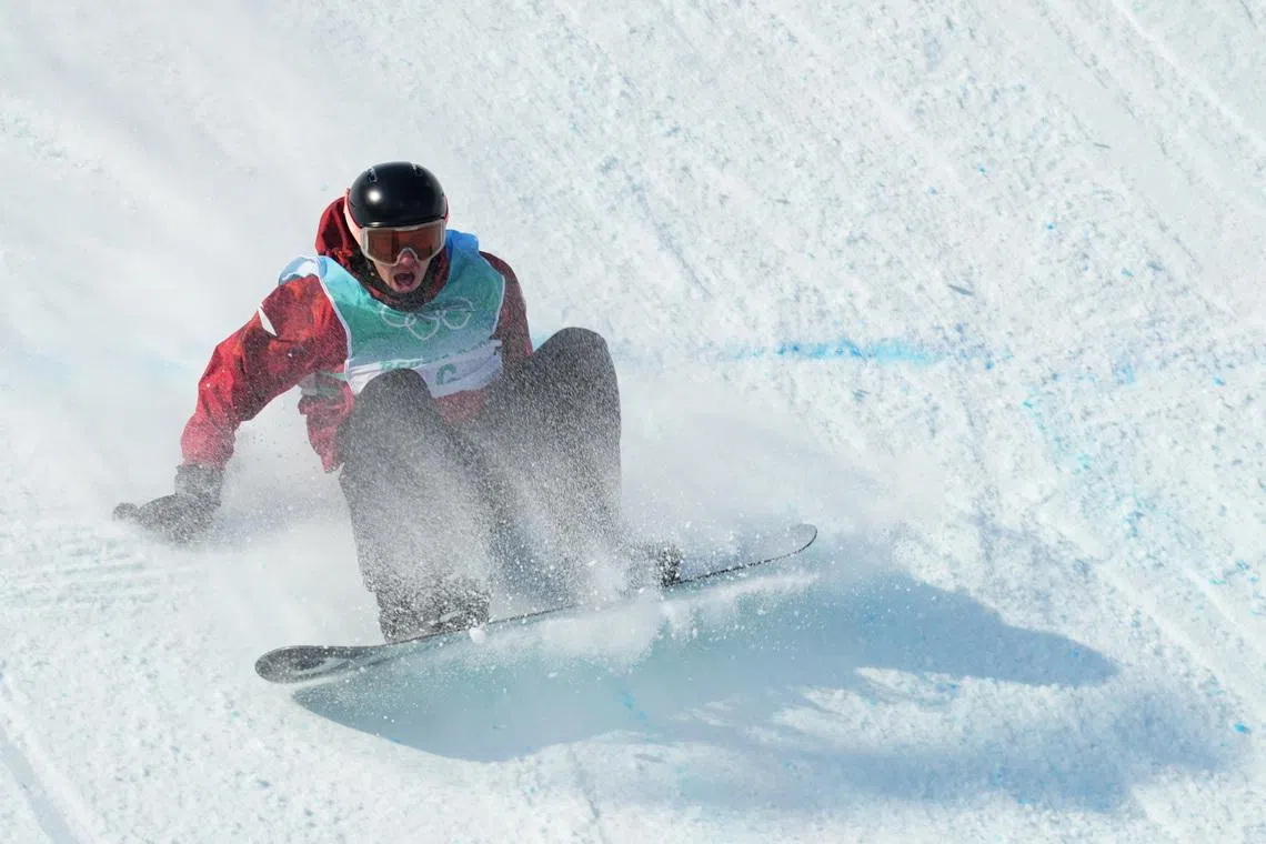 2022 Beijing Olympics - Snowboard - Men's Snowboard Big Air Final - Run 2 - Big Air Shougang, Beijing, China - February 15, 2022. Mark McMorris of Canada reacts as he falls during his run. REUTERS/Aleksandra Szmigiel