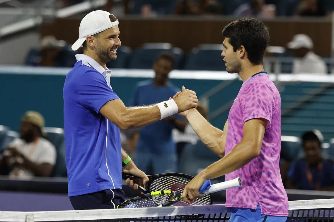 Mar 28, 2024; Miami Gardens, FL, USA; Grigor Dmitrov (BUL) (L) shakes hands with Carlos Alcaraz (ESP) (R) after their match on day eleven of the Miami Open at Hard Rock Stadium. Mandatory Credit: Geoff Burke-USA TODAY Sports