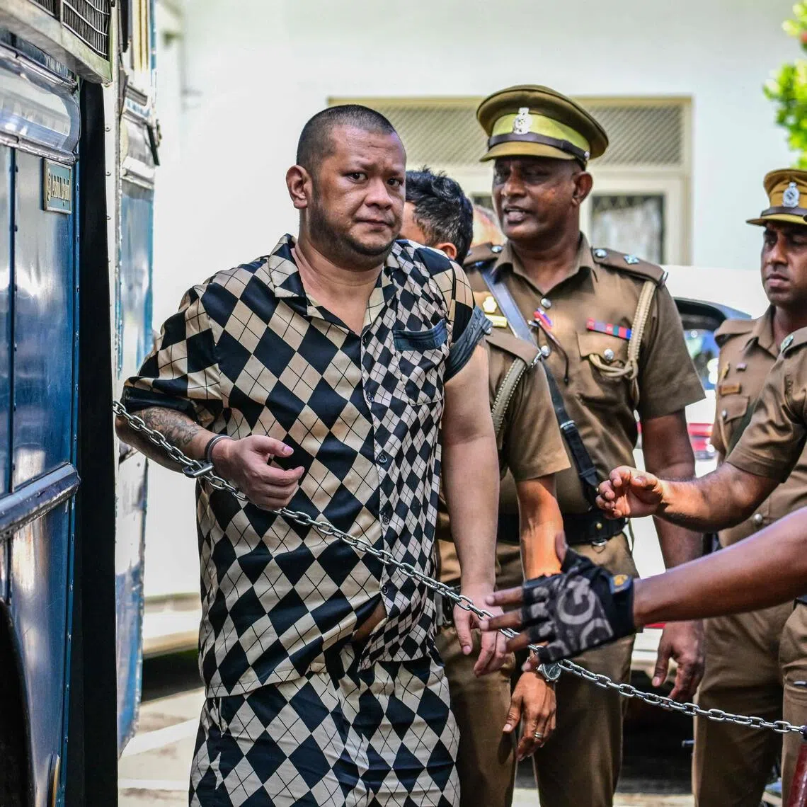 Prison guards escorting a foreign national in Kaduwela, a suburb of Colombo, in Sri Lanka, on May 7.
