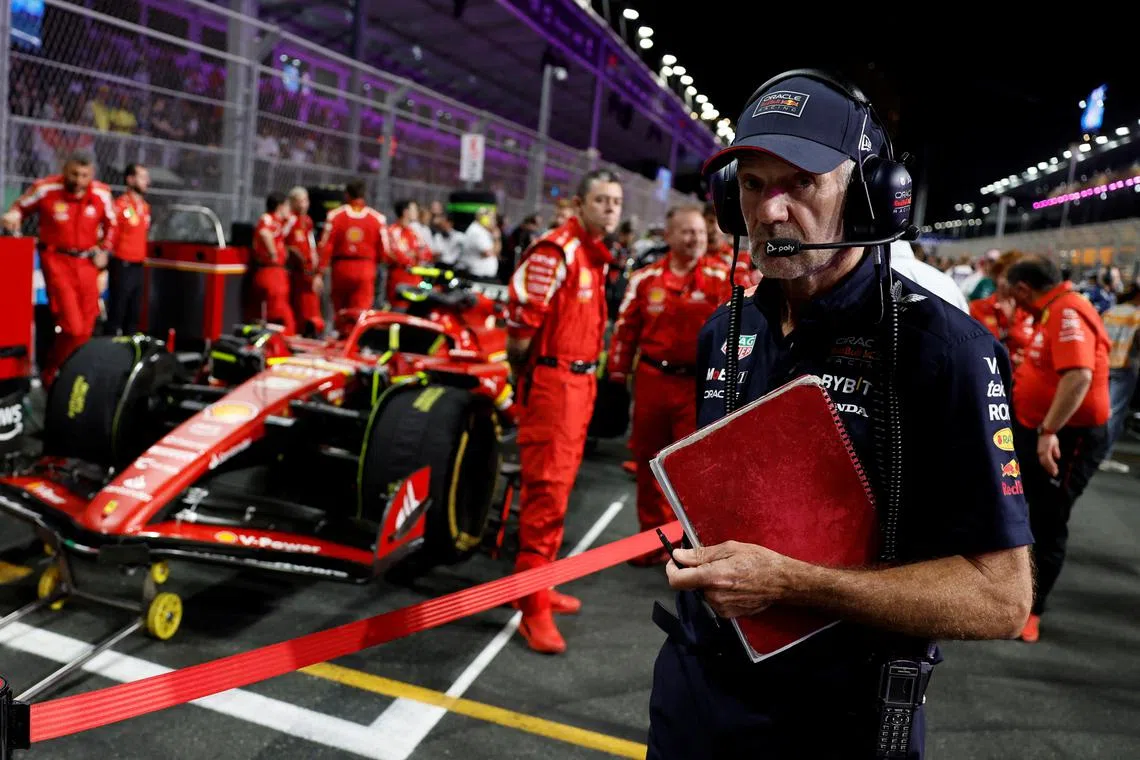 Formula One F1 - Saudi Arabian Grand Prix - Jeddah Corniche Circuit, Jeddah, Saudi Arabia - March 9, 2024 Red Bull's chief technology officer Adrian Newey with Ferrari engineers and Carlos Sainz Jr's car before the race REUTERS/Hamad I Mohammed/File Photo