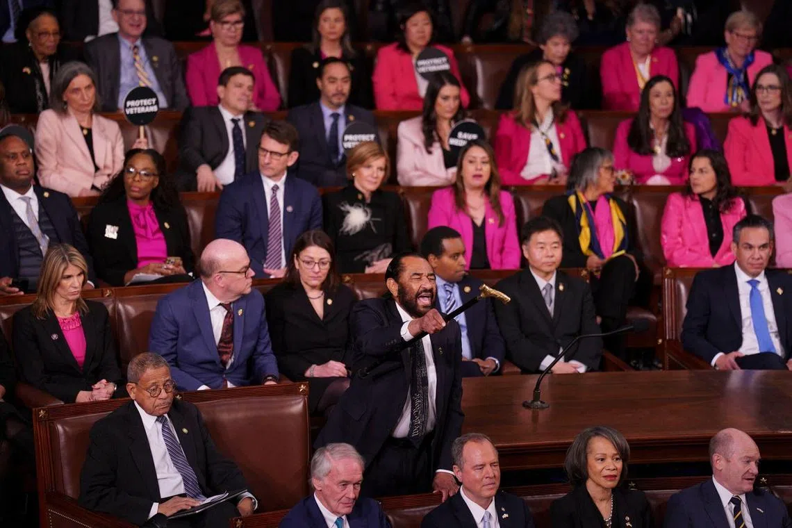 Representative Al Green, a Democrat from Texas, shouts as President Donald Trump addresses a joint session of Congress.