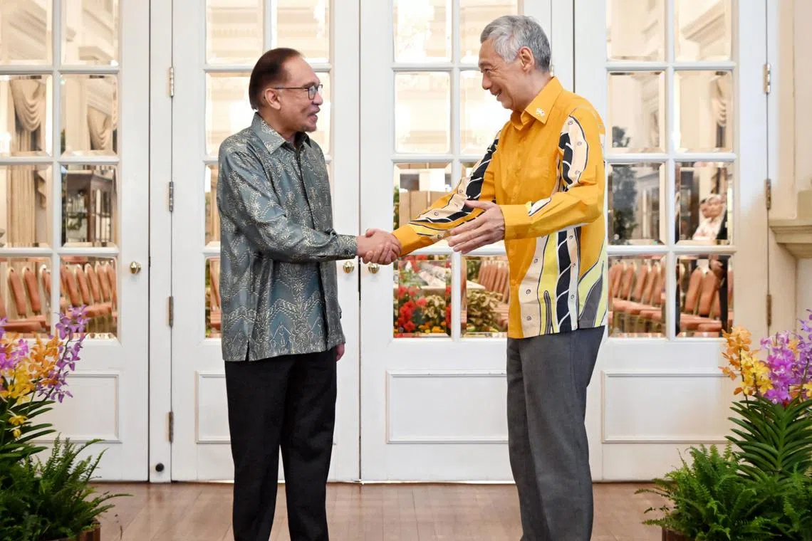 Malaysian PM Anwar Ibrahim meeting PM Lee Hsien Loong at the Istana for the leaders' retreat. Both countries reached agreements in several fields at the two-day event.