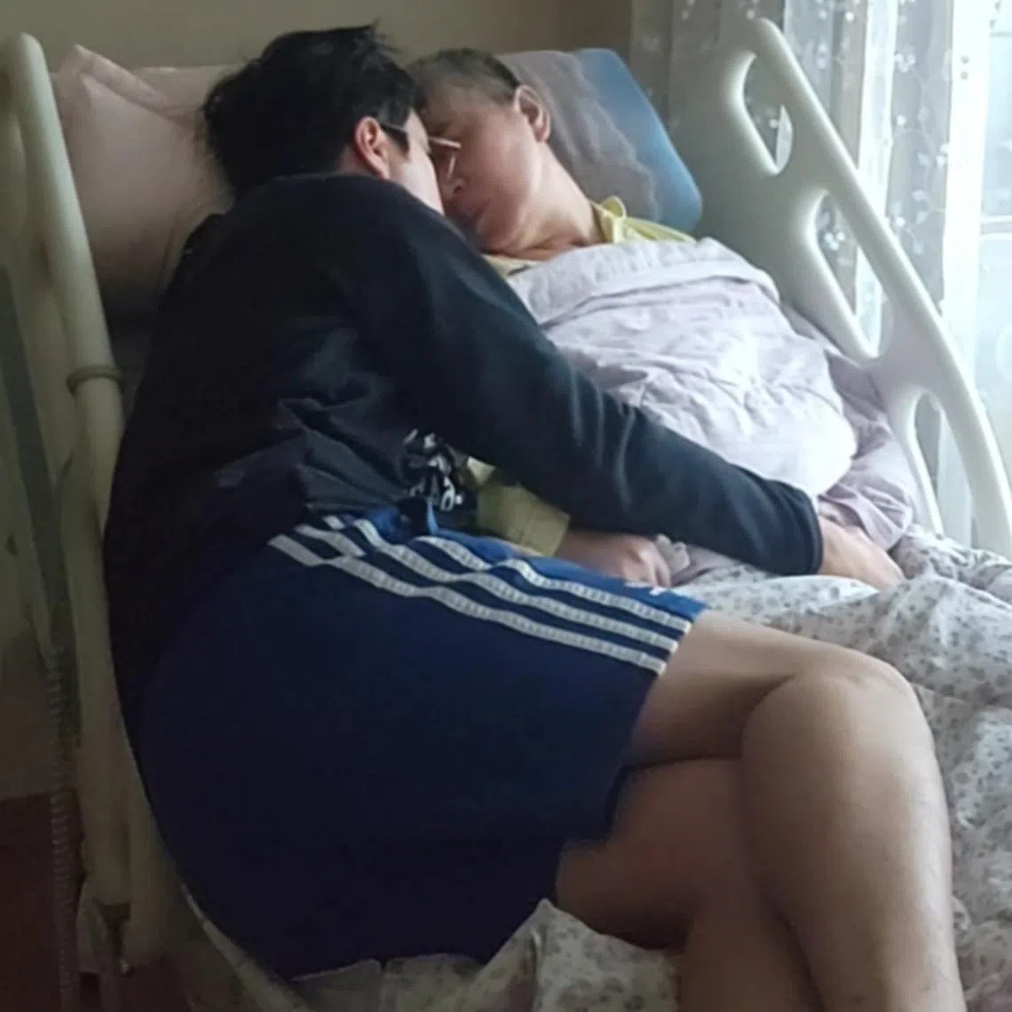 Mr Cho Bum-hee is the main caregiver for his bedridden mother.