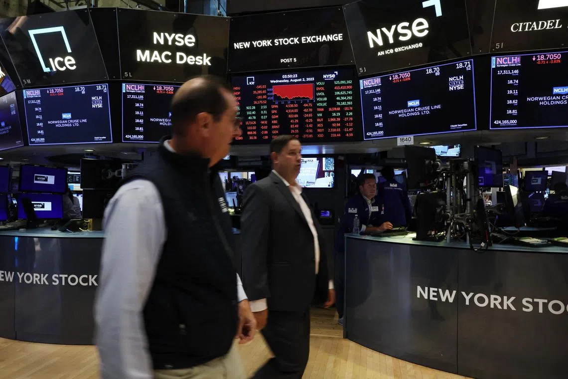 Traders work on the floor of the New York Stock Exchange, in New York City.