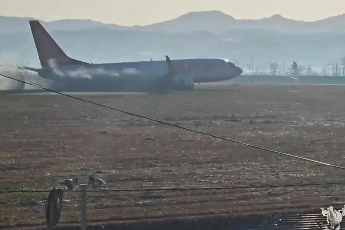 Black smoke emits from Jeju Air aircraft flight 7C2216 as it veers off the runway before crashing at Muan International Airport in Muan, South Korea December 29, 2024 in this screengrab obtained from video. Lee Geun-young/via REUTERS  THIS IMAGE HAS BEEN SUPPLIED BY A THIRD PARTY. MANDATORY CREDIT. NO RESALES. NO ARCHIVES. REFILE - CORRECTING INFORMATION FROM "FOLLOWING A CRASH AFTER LANDING" TO "BEFORE CRASHING".