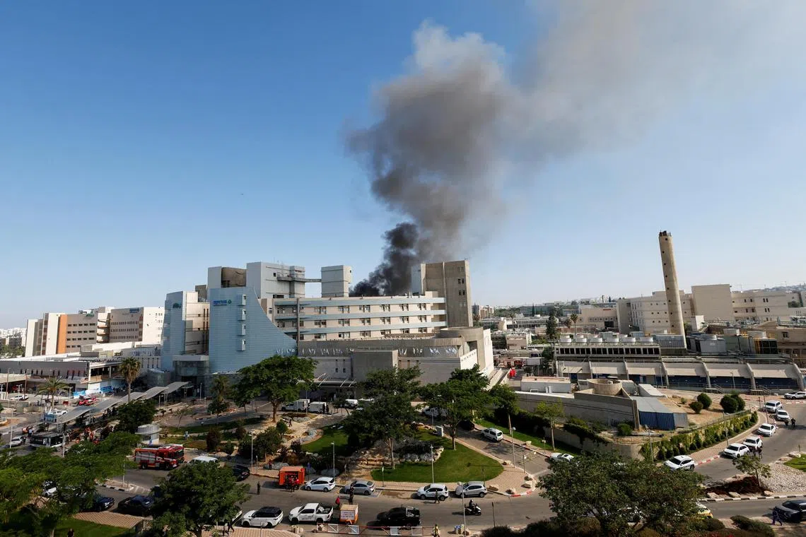Smoke rises from Soroka Medical Center, the city's general hospital, following a missile strike from Iran on Israel, in Beersheba, Israel June 19, 2025. REUTERS/Amir Cohen      TPX IMAGES OF THE DAY    