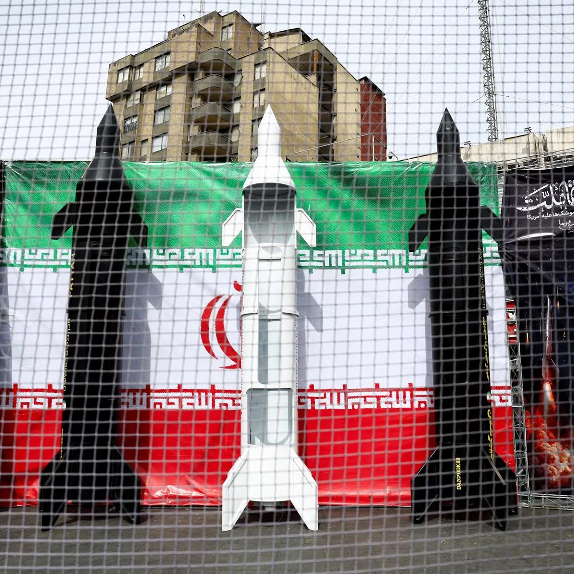 Symbolic mock-ups of Iranian missiles are displayed on a street, amid the U.S.-Israeli conflict with Iran, in Tehran, Iran, March 22, 2026. Majid Asgaripour/WANA (West Asia News Agency) via REUTERS