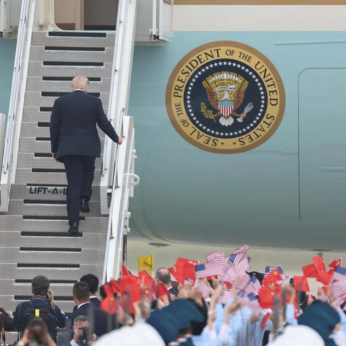 U.S. President Donald Trump ascends the stairs as he boards Air Force One to depart from Beijing Capital International Airport, in Beijing, China May 15, 2026. cnsphoto via REUTERS   ATTENTION EDITORS - THIS IMAGE WAS PROVIDED BY A THIRD PARTY. CHINA OUT. NO COMMERCIAL OR EDITORIAL SALES IN CHINA.