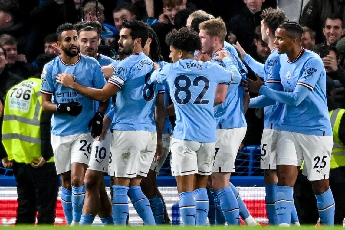 City's Riyad Mahrez (left) celebrates with teammates after scoring.