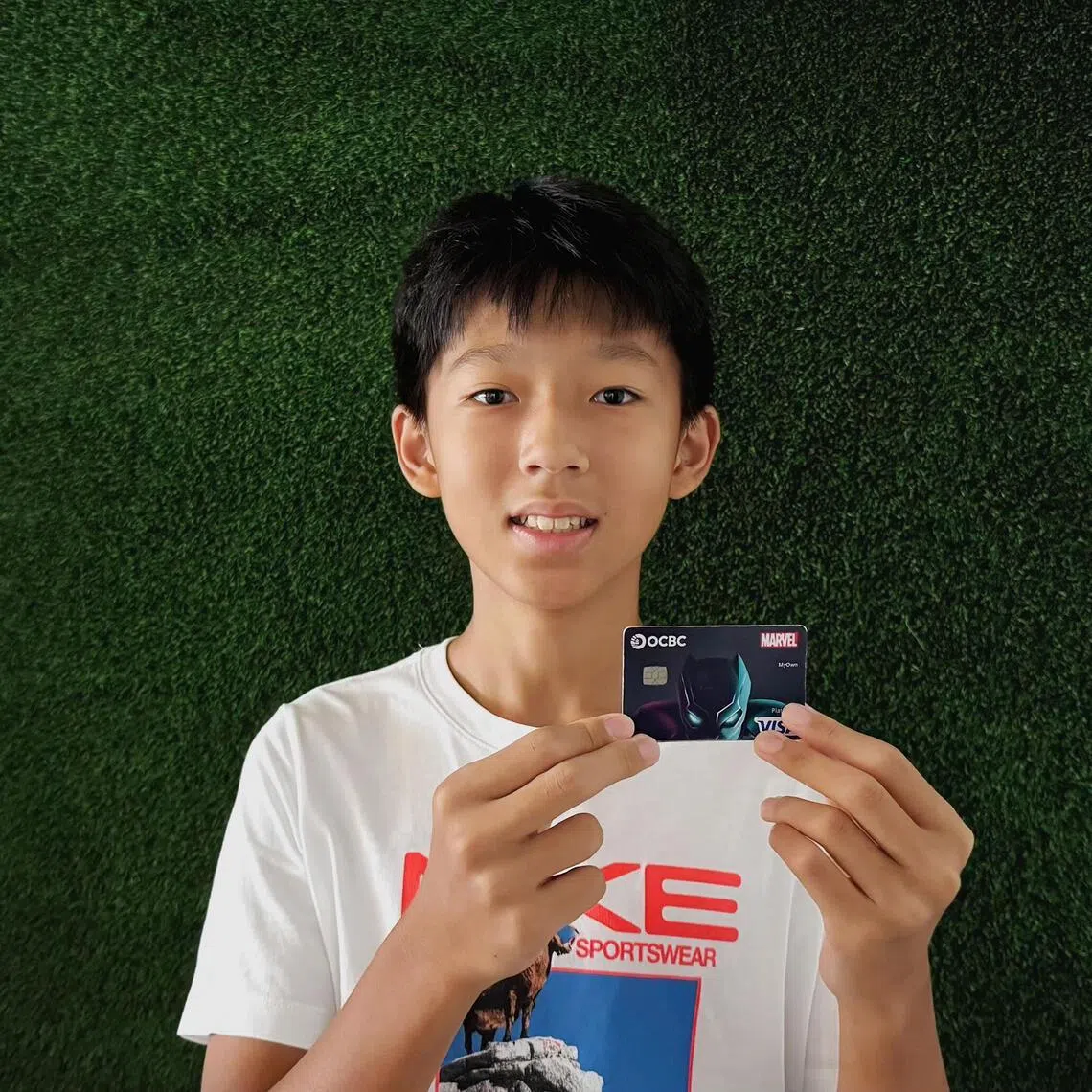 Oliver Png, 13, used physical cash to pay for things when he was younger, and was given an OCBC debit card for children in early 2025, when his mother felt he could better grasp how to manage money.