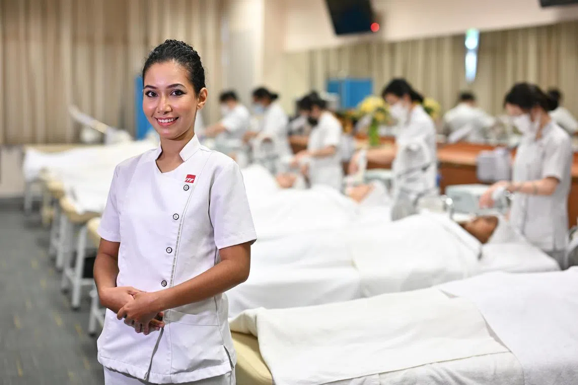 ST20240208-202411025522-Lim Yaohui-Elisha Tushara-etmature/
Ms Nurul Ashikin Binte Seman, 33, year 2 student in Nitec in Beauty & Wellness, at the beauty therapy centre in ITE College East on Feb 8, 2024.
The story is about mature learners (older than the average student) who undertake full-time courses at ITE.
We will be profiling a widowed 34 year old, Ashikin, with a 9 year old son, who decided to enrol in a full time Nitec in Beauty & Wellness course. She will be sharing why she made this decision, how she supports herself and her son financially since she studies full time, and what she hopes to do once she graduates.
(ST PHOTO: LIM YAOHUI)