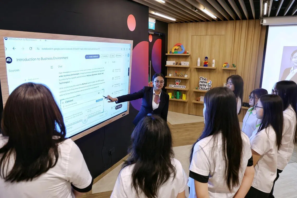 Year 2 Higher Nitec in Business Information Systems student Nur Syahirah Mohammed Zamri, 19, introducing the features of Google NotebookLM to her peers during a Generative AI workshop in the AI Living Lab at ITE College East on Feb 4.