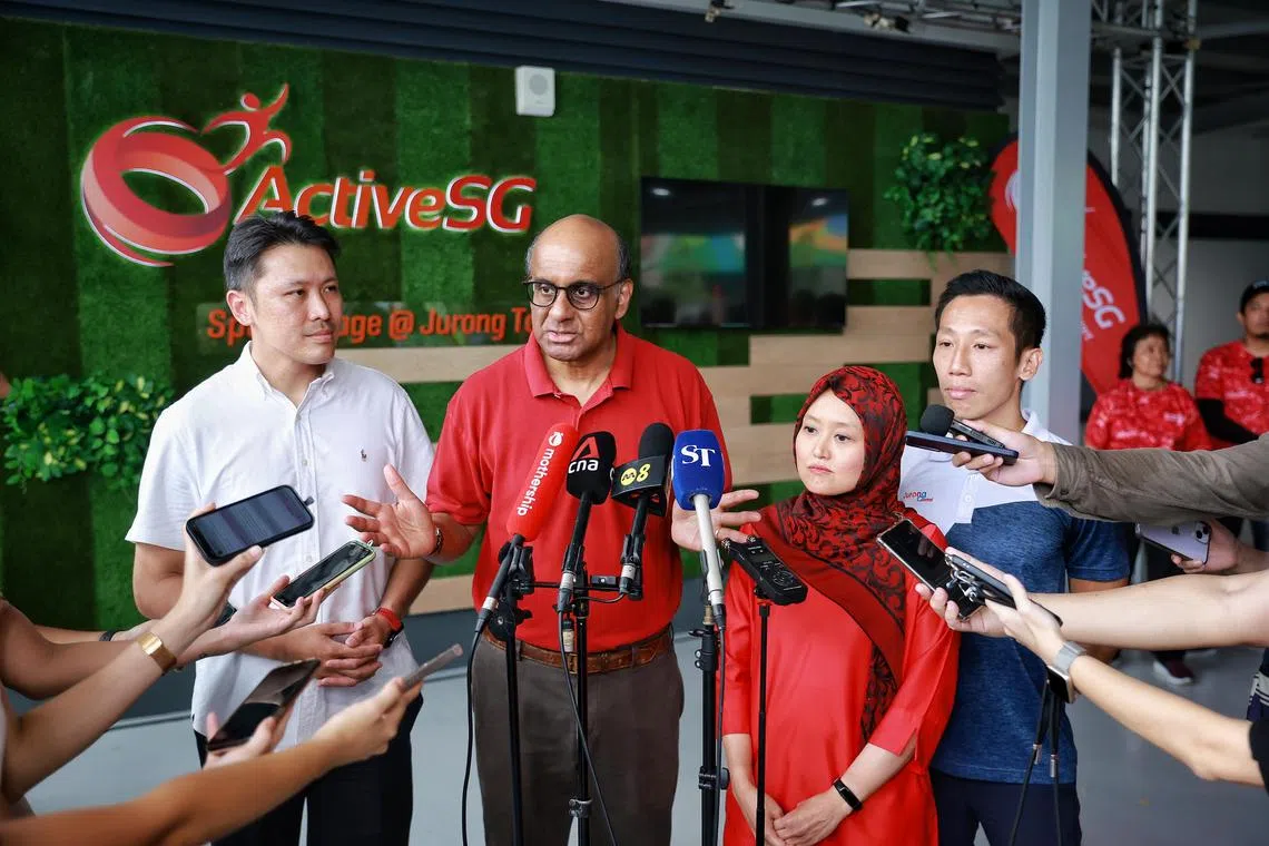 Senior Minister Tharman Shanmugaratnam (second from left) and Jurong GRC MPs (from left) Shawn Huang, Rahayu Mahzam and Xie Yao Quan at the opening of ActiveSG Sport Village @ Jurong Town on Sunday. 