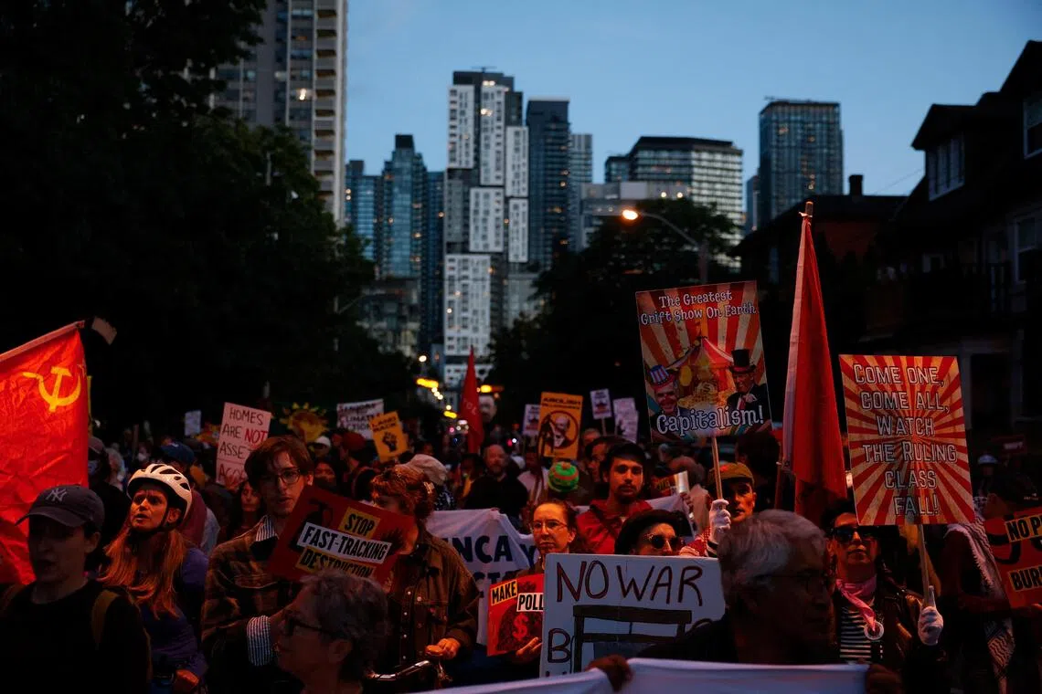 Hundreds march in Toronto against Carney’s investment summit