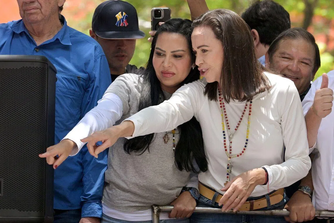Venezuelan opposition leader Maria Corina Machado (right) and Ms Delsa Solorzano during a rally in Caracas in 2024.