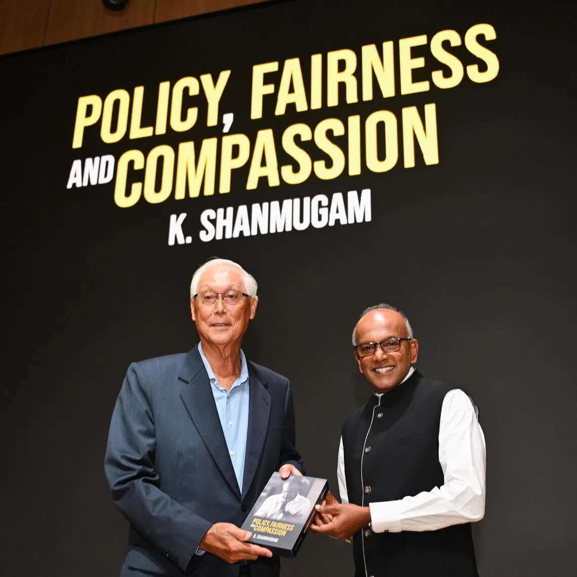 Coordinating Minister for National Security and Minister for Home Affairs K Shanmugam presenting his book Policy, Fairness and Compassion to ESM Goh Chok Tong on Feb 6.