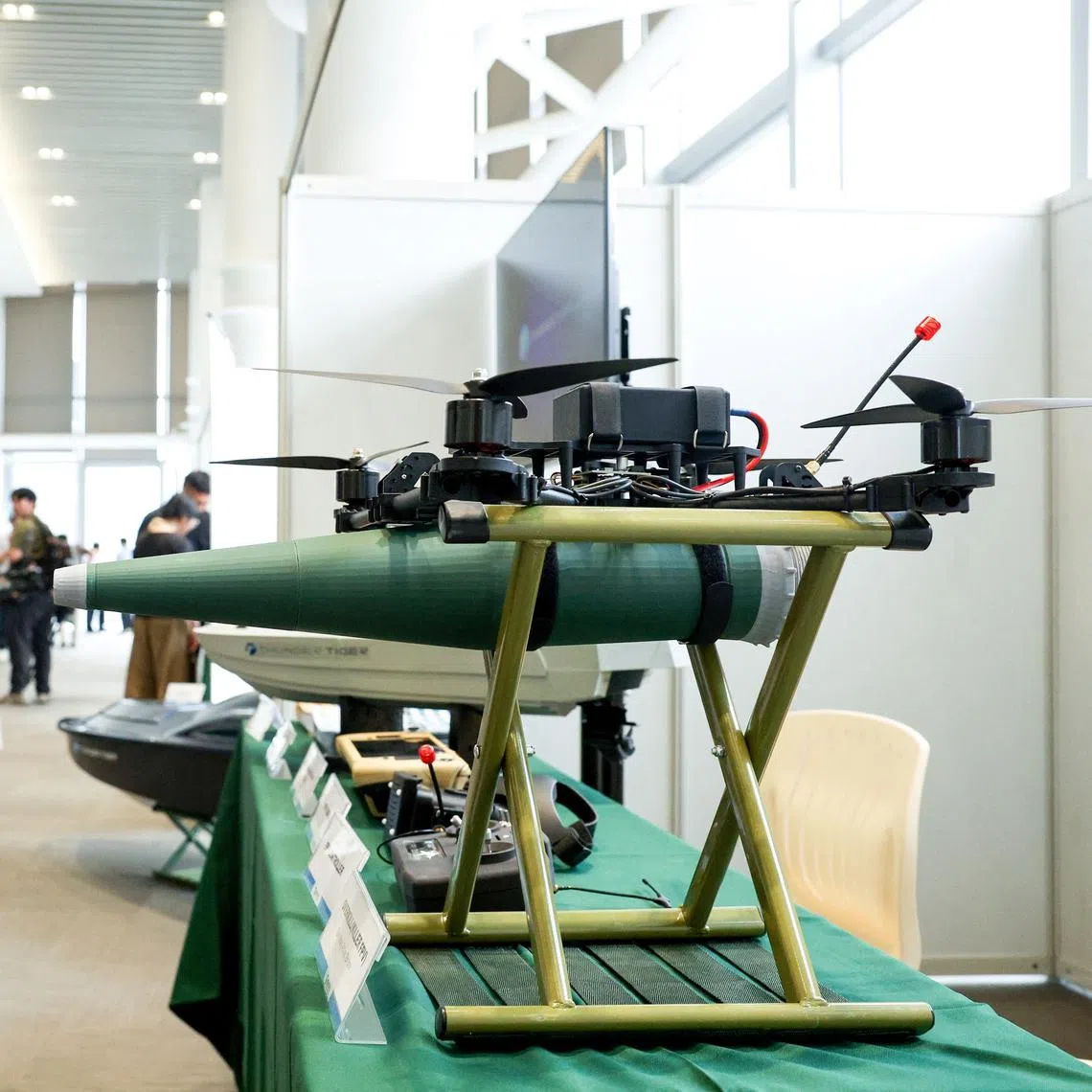 Visitors look at an Overkill Killer FPV one way attack drone displayed during an event held by the National Chung-Shan Institute of Science and Technology in Yilan on June 17.