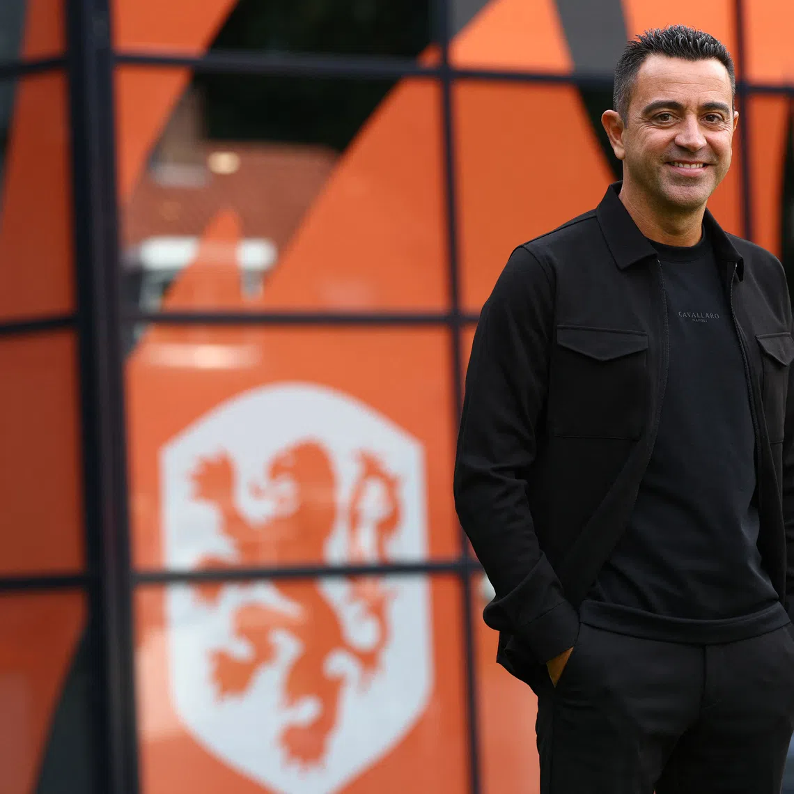 Soccer Football - Netherlands unveil Xavi Hernandez as new coach - KNVB Campus, Zeist, Netherlands - August 25, 2026 Netherlands coach Xavi Hernandez poses for a picture REUTERS/Piroschka Van De Wouw