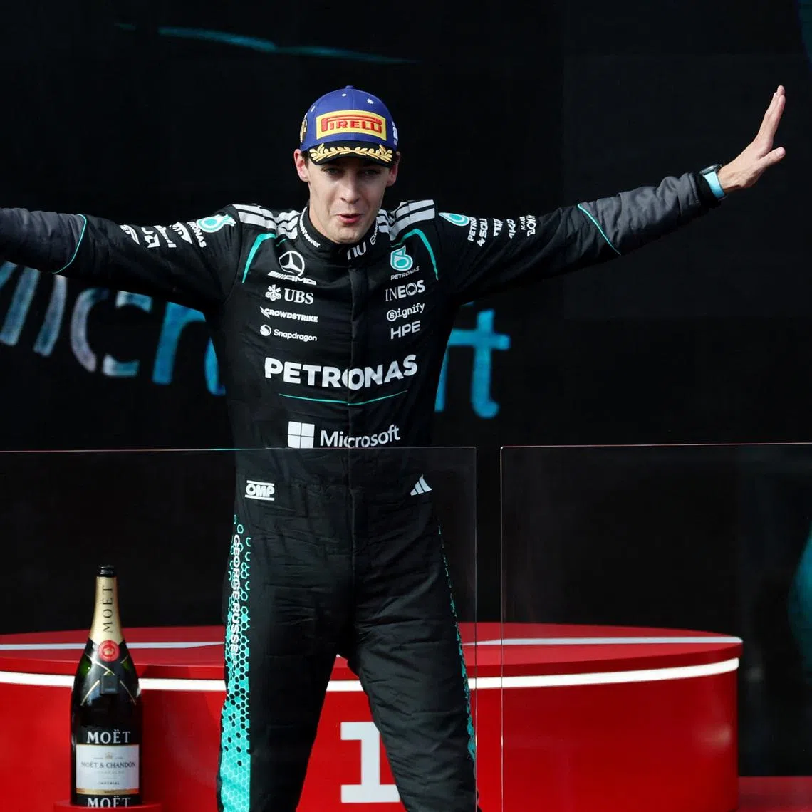 Mercedes' George Russell celebrates on the podium after winning the Australian Grand Prix.