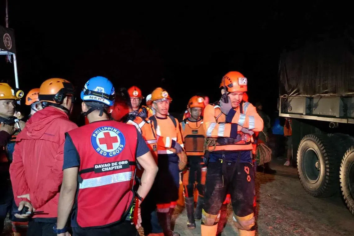 Eleven people were injured, with one in critical condition after a rain-induced landslide buried two buses in the southern Philippines. 