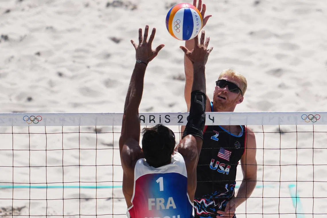Paris 2024 Olympics - Beach Volleyball - Men's Preliminary Phase - Pool F - France vs United States of America (Krou/Gauthier-Rat vs Evans/Budinger) - Eiffel Tower Stadium, Paris, France - July 29, 2024.
Chase Budinger of United States in action against Youssef Krou of France. REUTERS/Aleksandra Szmigiel