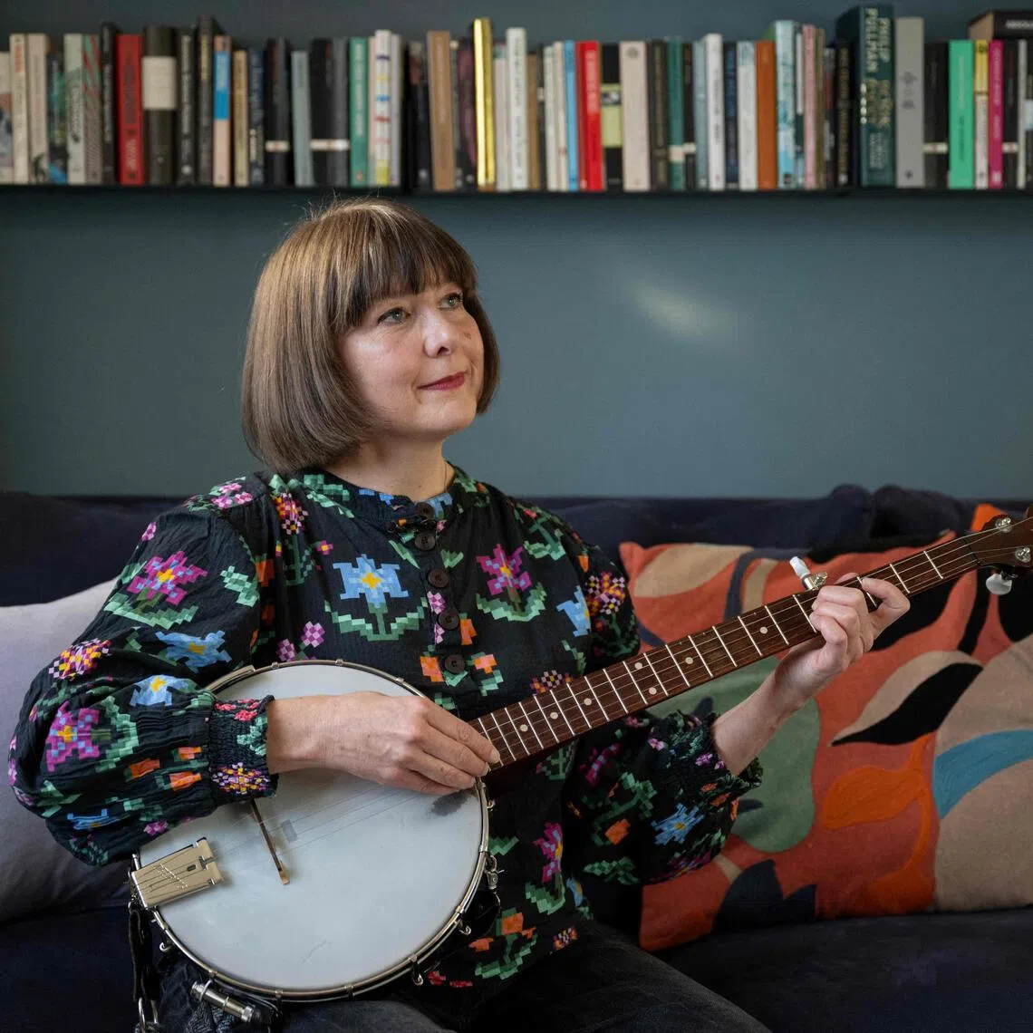 Folk singer Emily Portman, who found a counterfeit potentially AI-generated album purporting to be created by her online, poses for a photograph in Sheffield, northern England, on November 21, 2025. British folk musician Emily Portman was taken by surprise in July when she received a message from a fan congratulating her on her new album — even though she hadn't released one since 2022. That's when she discovered "Orca" in her Spotify and Apple Music catalogues. The titles of the songs were like something she might have created herself, but "very quickly I recognised it was AI-produced music", she said. (Photo by Oli SCARFF / AFP)
