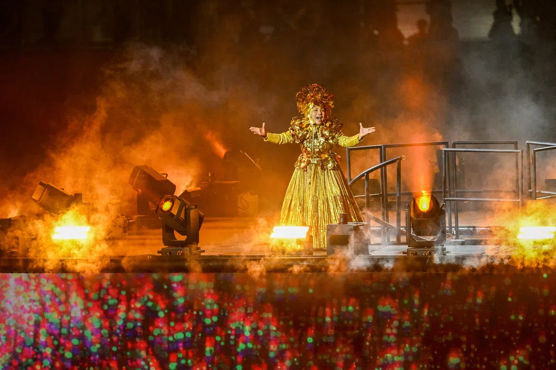 Orang Laut singer Asnida Daud performing a piece titled Aok Diko (“Yes, Of Course.”) in the Orang Laut dialect during Chapter 3 of National Day Parade 2026 at the National Stadium on Aug 9, 2026.