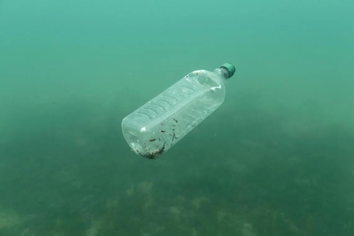 FILE PHOTO: A plastic bottle is seen floating in an Adriatic sea of the island Mljet, Croatia, May 30, 2018. Picture taken May 30, 2018. REUTERS/Antonio Bronic/File Photo