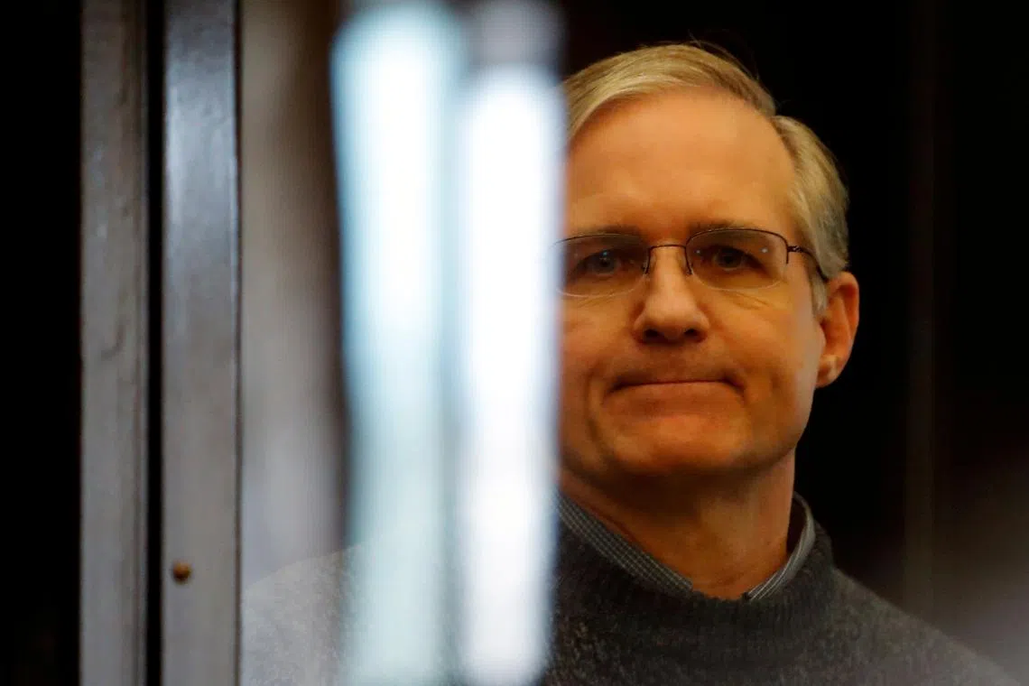 Former U.S. Marine Paul Whelan, who was detained and accused of espionage, stands inside a defendants' cage during his verdict hearing in Moscow, Russia June 15, 2020. REUTERS/Maxim Shemetov/File Photo