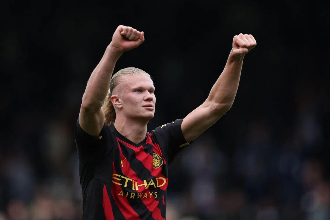 Manchester City's Norwegian striker Erling Haaland celebrating on the pitch after the English Premier League football match between Fulham and Manchester City at Craven Cottage in London on Sunday. City won 2-1 with Haaland scoring from the spot.