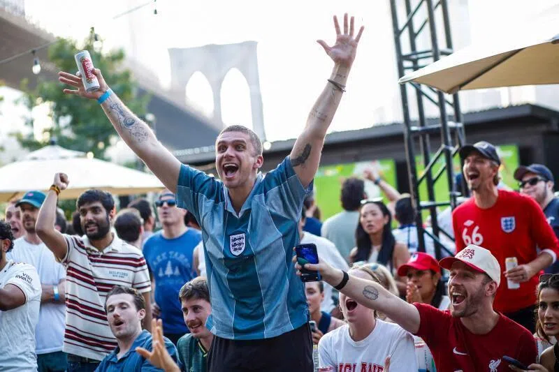 England fans react as their team scores a goal during a watch party of the World Cup quarterfinal football match between England and Norway in Brooklyn, New York, on July 11.